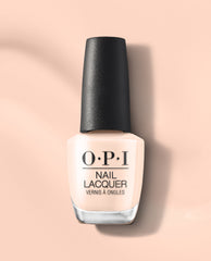 OPI Throw Me a Wink nail lacquer bottle in a soft pale peach shade with a black cap, shown upright on a peach background for fall nail colors.