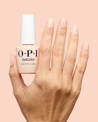 OPI GelColor Throw Me a Wink pale nude-pink gel nail polish is shown on glossy manicured nails beside the matching bottle, a soft option for fall nail colors.