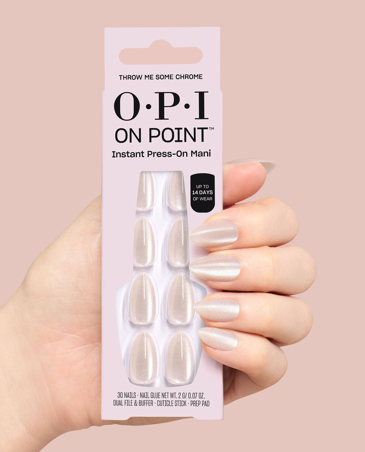 Hand holds OPI On Point Throw Me Some Chrome instant press-on mani box, showing pearly chrome almond nails and up to 14 days wear against a soft pink background, ideal for fall nail colors.