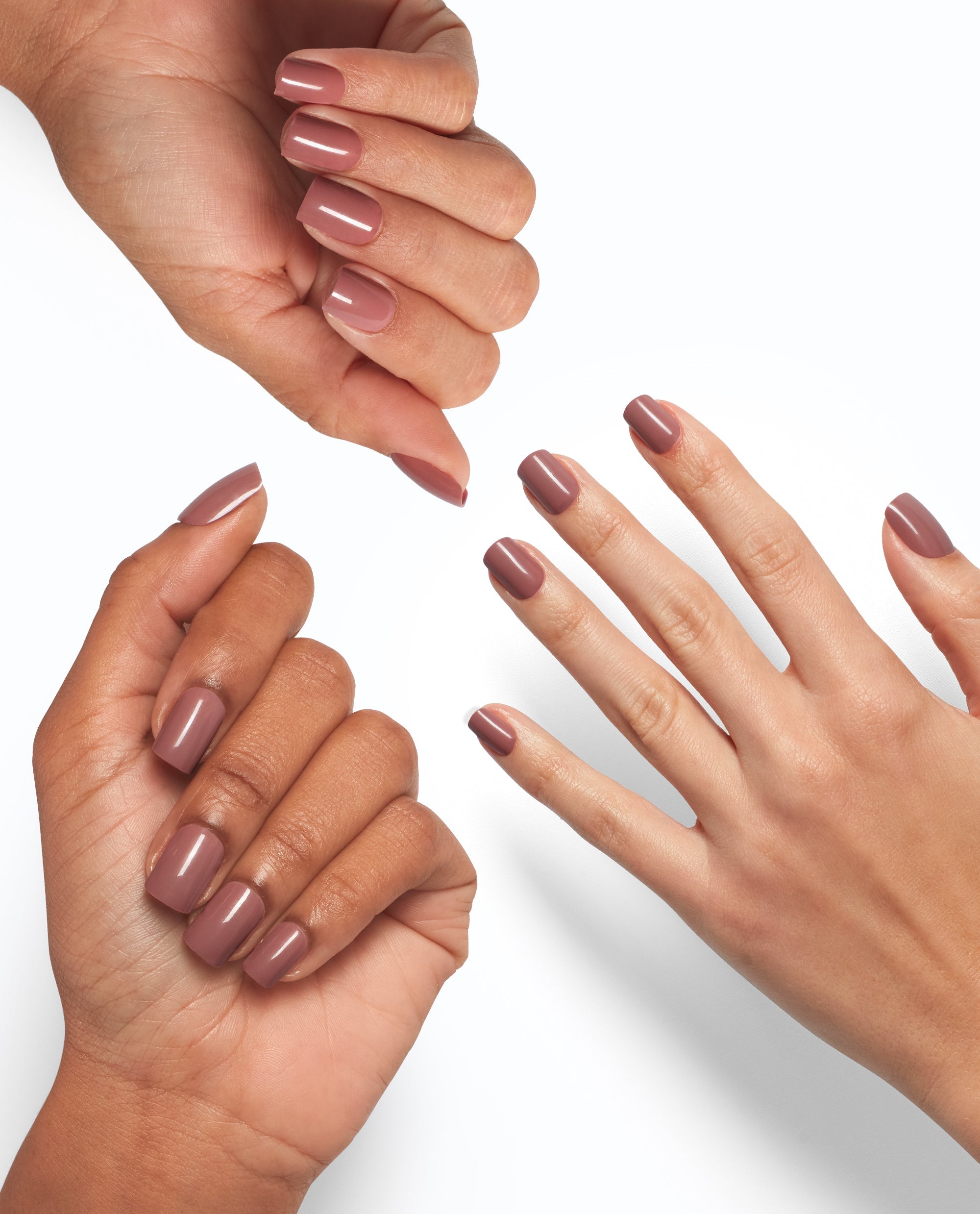 Three hands display glossy mauve nails painted with OPI Tickle My France-y, showcasing the On Point nude shade on different skin tones against a clean white background, ideal for promoting an OPI nail polish gift set.