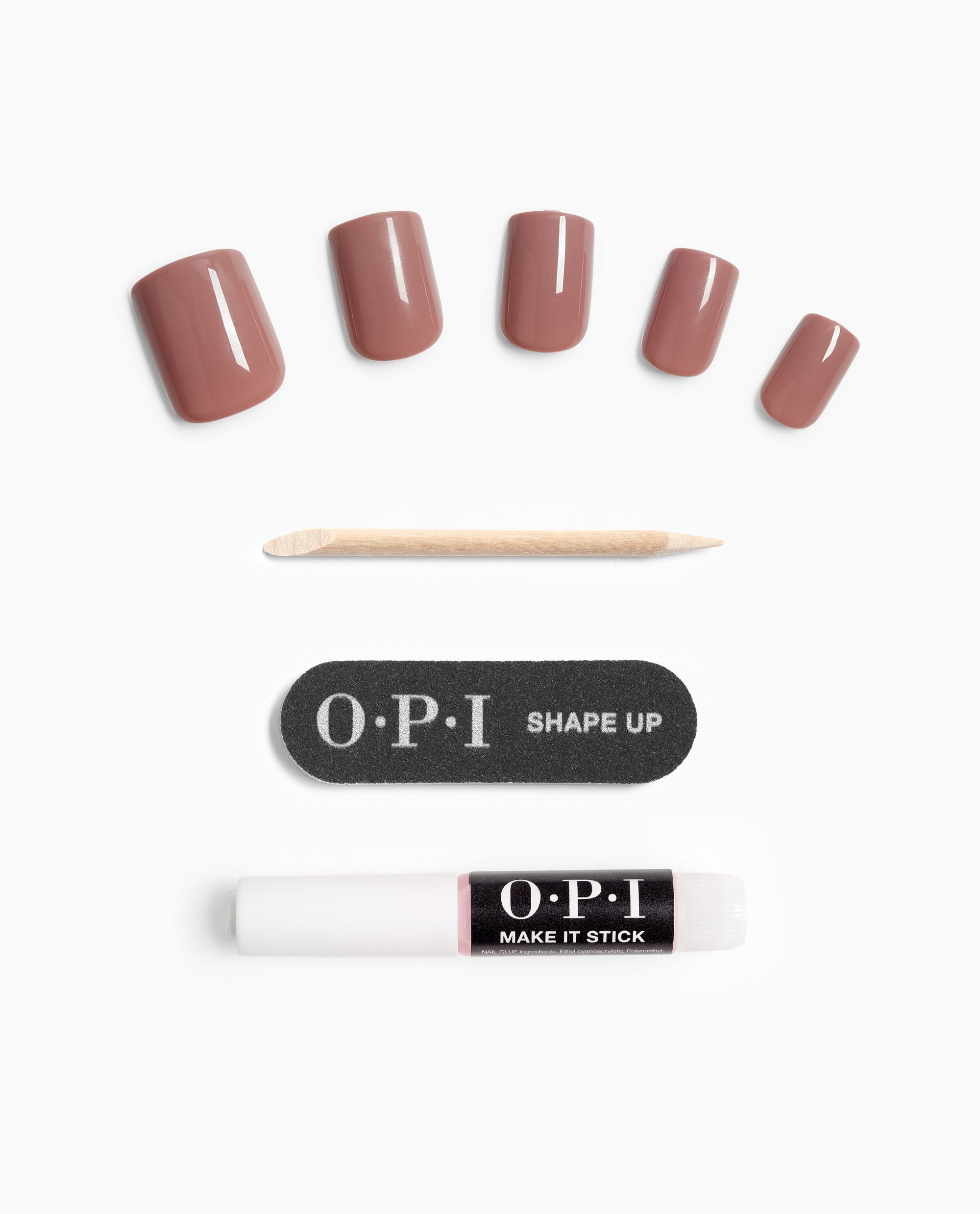 Tickle My France-y On Point OPI nail polish gift set showing mauve press-on nails in multiple sizes arranged above a wooden cuticle stick, black OPI Shape Up nail file, and white OPI Make It Stick adhesive pen on a white background.