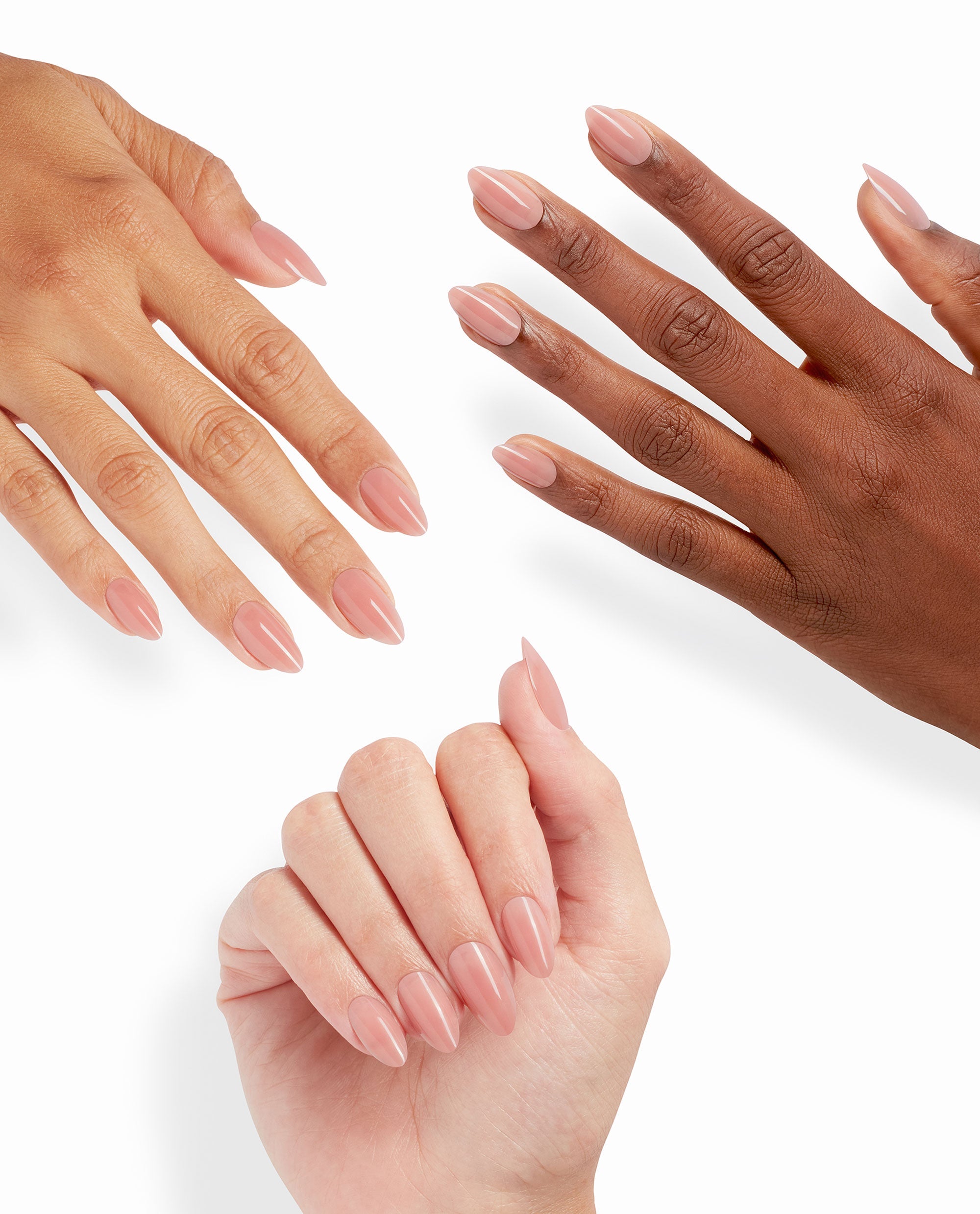 Three hands showcase Totally Pressed xPRESS/ON Iconic Shades (Long), featuring glossy almond-shaped nude press-on nails fanned against a clean white background, highlighting this OPI nail polish gift set alternative for salon-quality manicures at home.