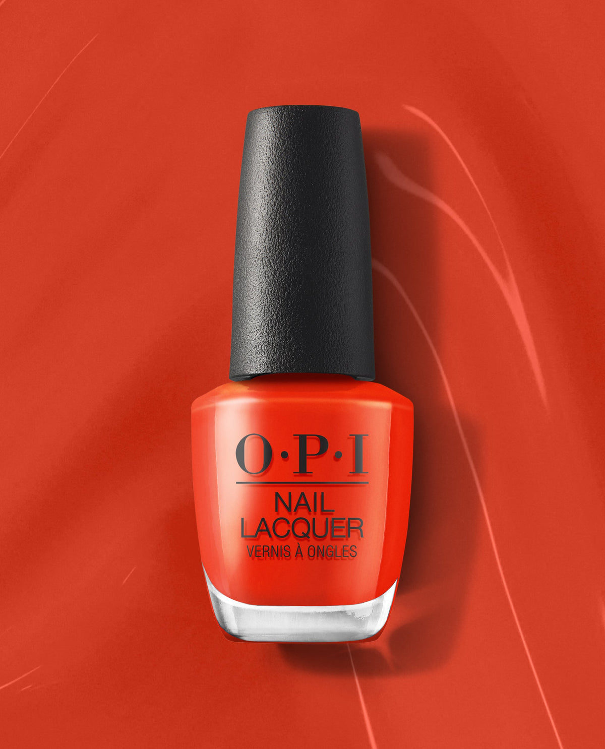 OPI Totally Red-ical Nail Lacquer bottle in vivid orange-red polish stands upright with a black cap on a matching red background, showcasing a bold fall nail color.