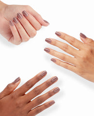 Hands model OPI xPRESS/ON Track Suited Cutie press-on nails in a glossy mauve shimmer shade, showcasing chic fall nail colors against a clean white background.