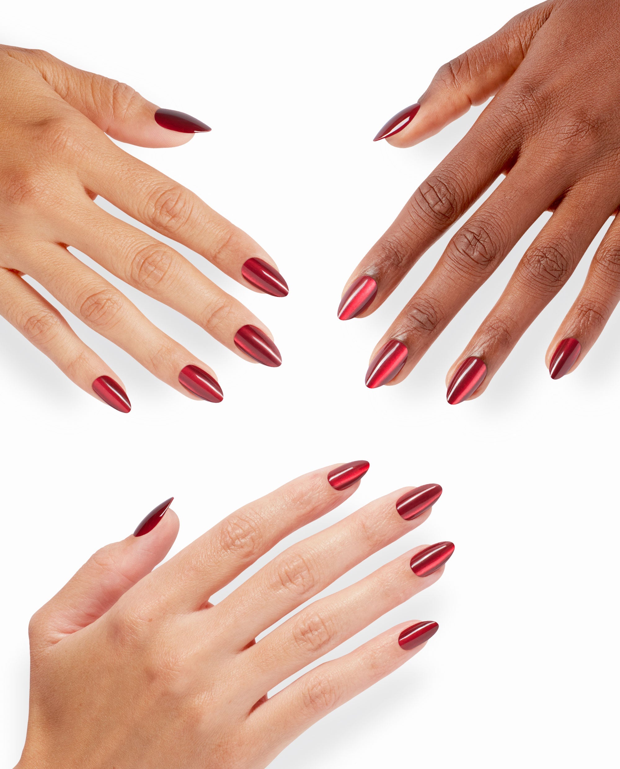 Hands with varied skin tones showcase OPI Undercover Waitress xPRESS/ON nails, a glossy deep red chrome almond manicure ideal for bold fall nail colors on a clean white background.