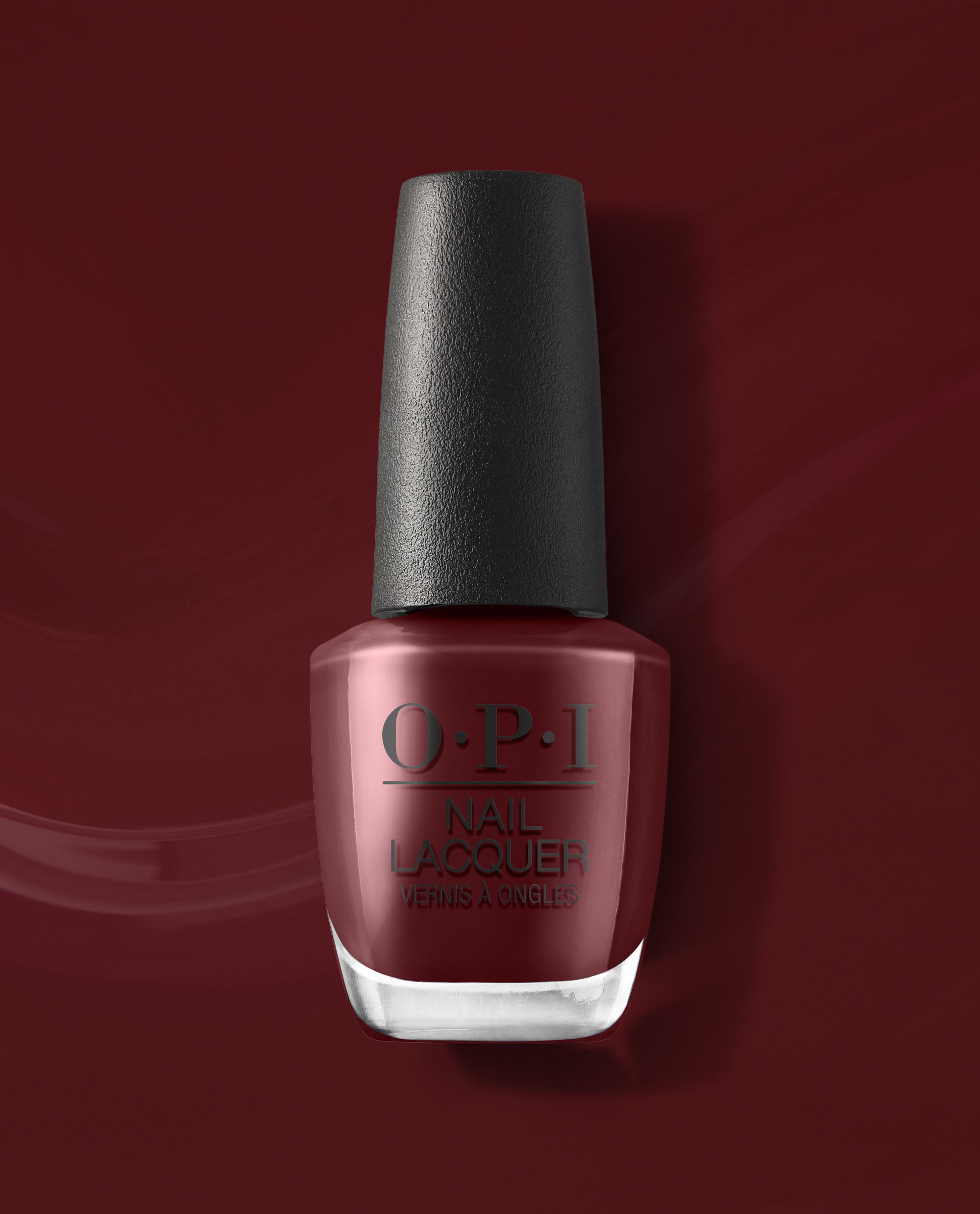 OPI Vampire State Building nail lacquer bottle displays a deep burgundy red fall nail color with a black cap, set against a glossy matching red polish background.