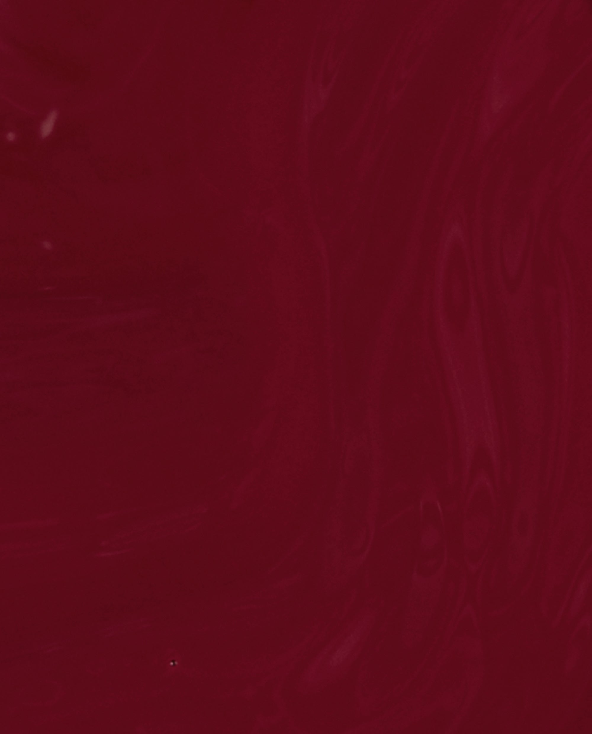 We the Female nail lacquer appears as a glossy deep burgundy red swatch, showcasing an OPI shade ideal for rich fall nail colors.