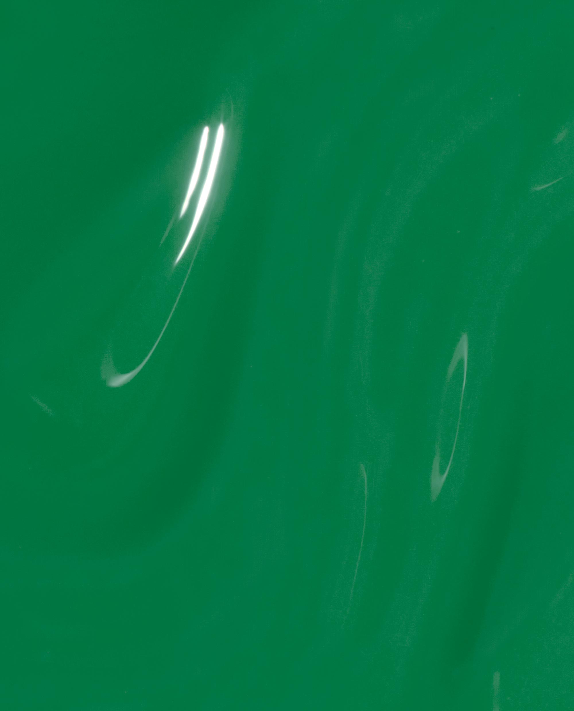 Won for the Ages Infinite Shine by OPI swatch displaying glossy medium emerald green nail polish with a smooth crème finish, light reflecting on a close-up lacquer surface—fresh, salon-ready shade for spring nail colors.