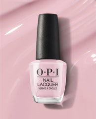 OPI nail polish bottle of You’ve Got that Glas-glow nail lacquer standing upright, showcasing its soft pastel pink shade with a black cap against a glossy light pink background, highlighting a smooth, glass-like finish.
