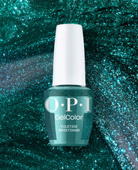 OPI GelColor Yuletide Sweetings! bottle standing upright, displaying a shimmery teal green gel nail polish with a white cap against a sparkling glitter backdrop, an OPI green nail polish choice for spring nail colors and festive looks.