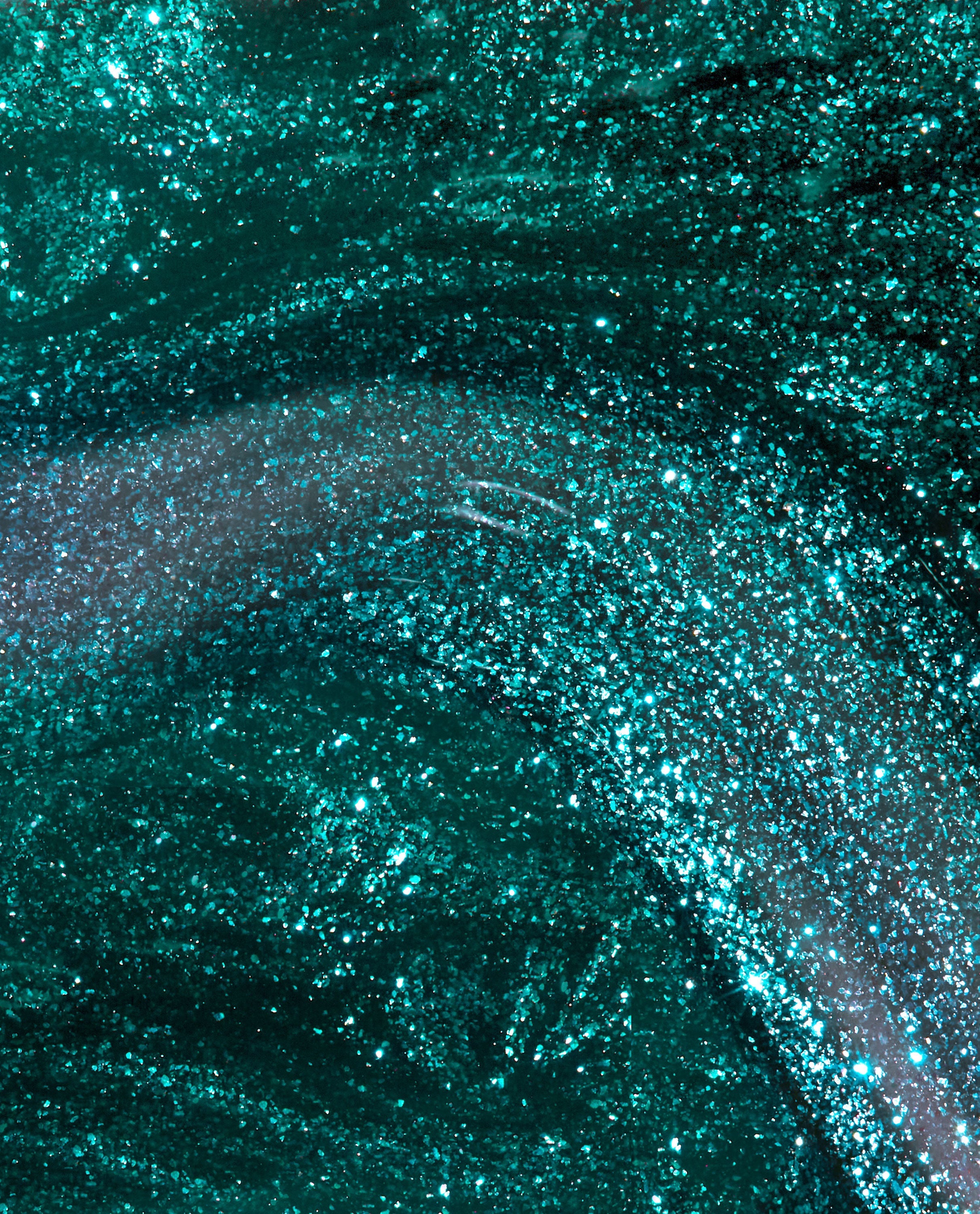 Yuletide Sweetings! nail lacquer swatch—emerald green nail polish swirling with fine glitter, shimmering under light in a glossy macro close-up; a festive pick for spring nail colors that complements OPI collections.